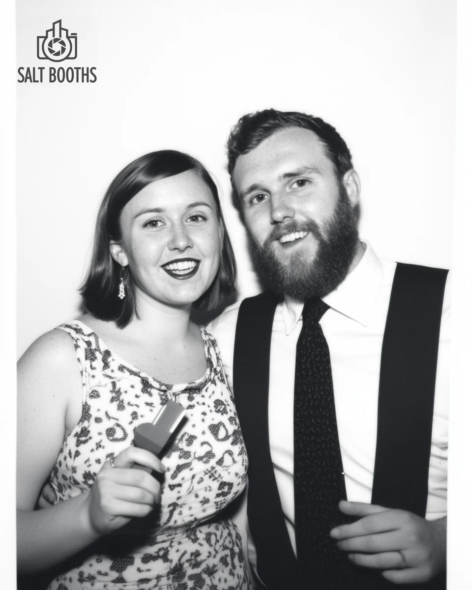 Black-and-white Glam booth portrait of a couple with a soft film look