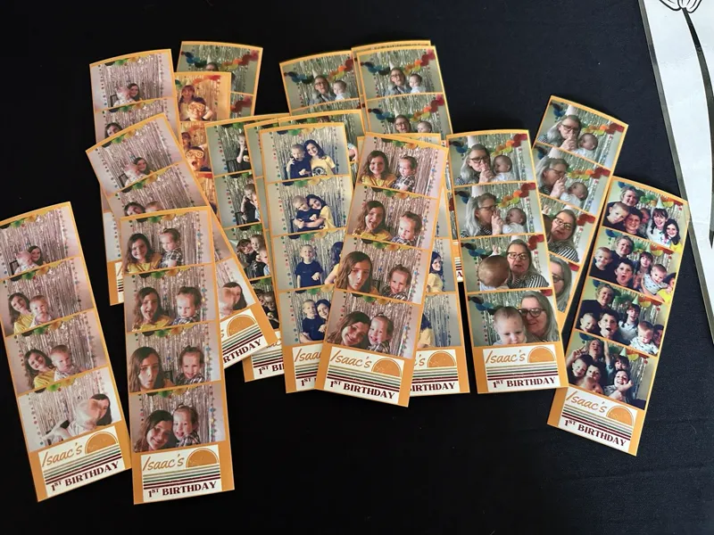 Stack of custom-printed 2x6 photo strips from a real Salt Booths event