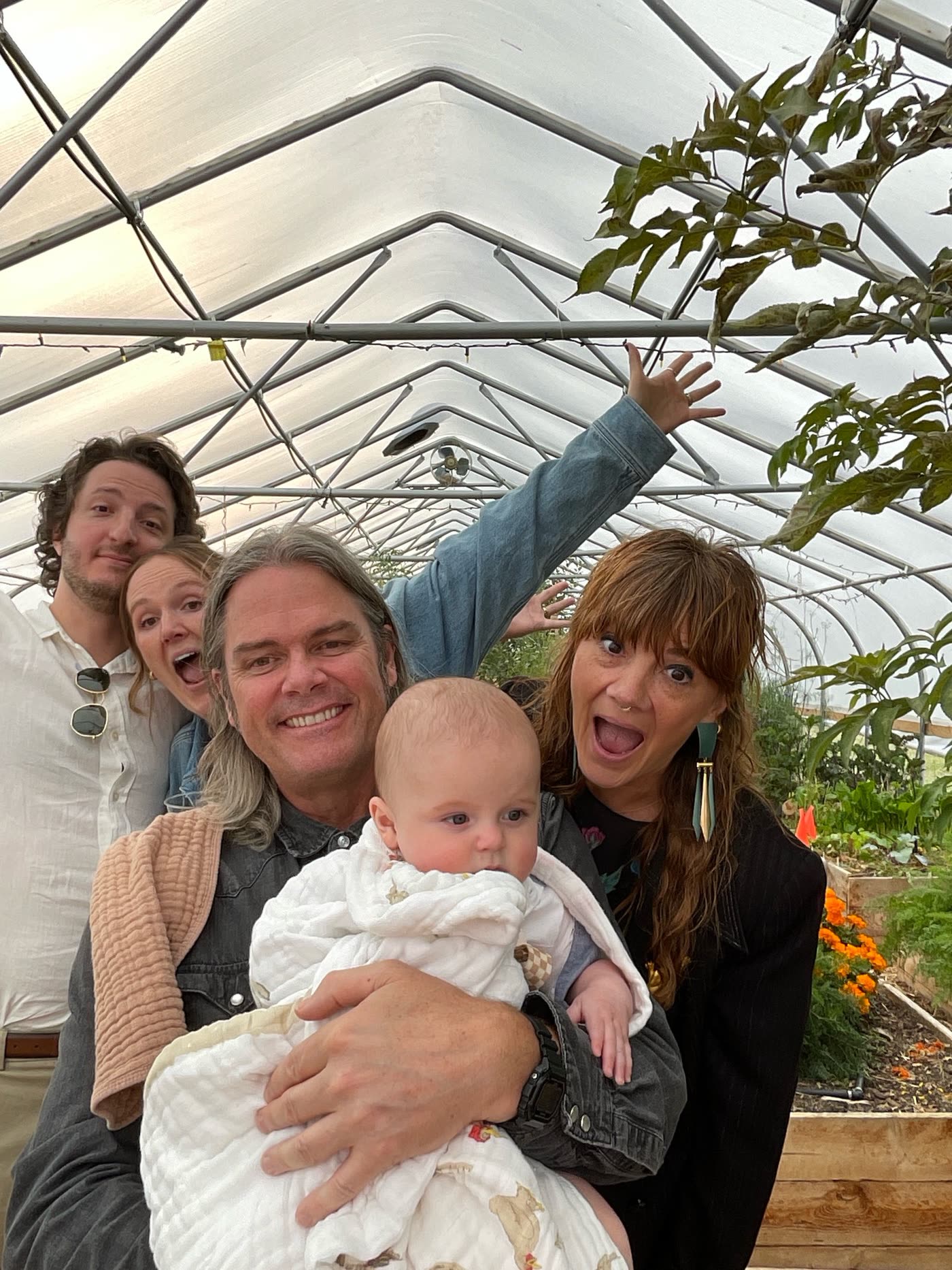 Family with baby in greenhouse venue